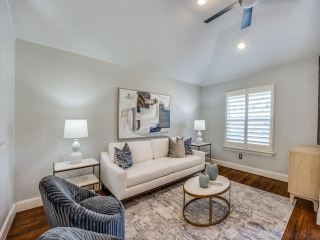 living room with vaulted ceiling, dark hardwood / wood-style floors, and ceiling fan