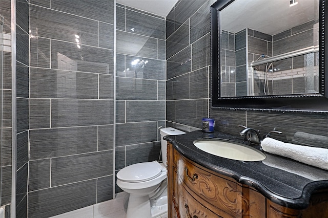 bathroom featuring toilet, tile walls, vanity, tile patterned flooring, and backsplash