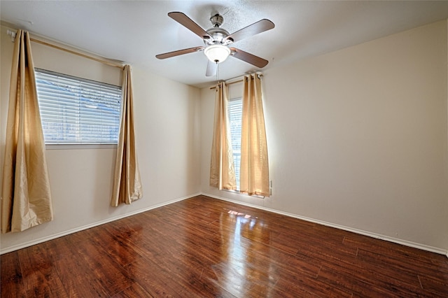 spare room featuring hardwood / wood-style flooring and ceiling fan