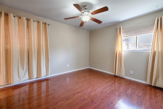 empty room featuring hardwood / wood-style flooring and ceiling fan