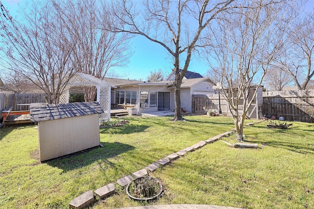 view of yard with a shed and a deck