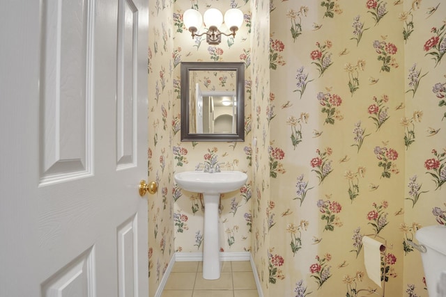 bathroom with tile patterned flooring and toilet