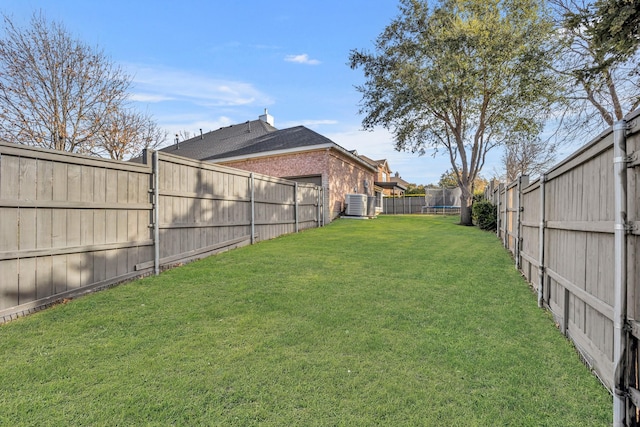 view of yard featuring cooling unit and a trampoline