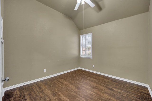 unfurnished room featuring vaulted ceiling, dark hardwood / wood-style floors, and ceiling fan