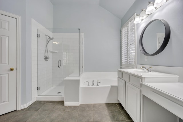 bathroom featuring lofted ceiling, vanity, tile patterned floors, and shower with separate bathtub