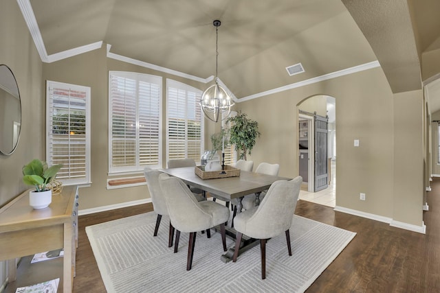 dining area with an inviting chandelier, lofted ceiling, dark hardwood / wood-style floors, and crown molding