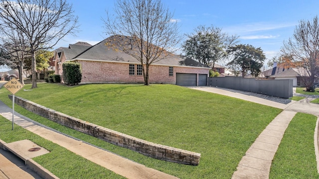 view of front of home with a garage and a front yard