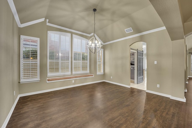 unfurnished dining area featuring hardwood / wood-style flooring, ornamental molding, lofted ceiling, and a notable chandelier