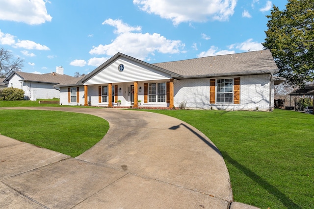 ranch-style home with a front lawn and covered porch