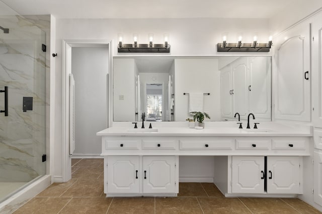 bathroom featuring vanity and a shower with shower door