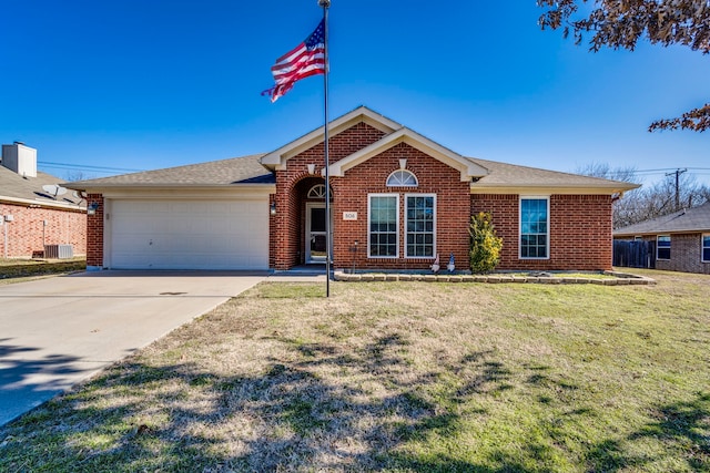 ranch-style house featuring a garage and a front yard