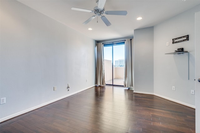 unfurnished room featuring dark hardwood / wood-style floors and ceiling fan