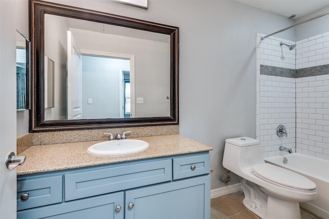 full bathroom featuring vanity, tile patterned flooring, tiled shower / bath combo, and toilet