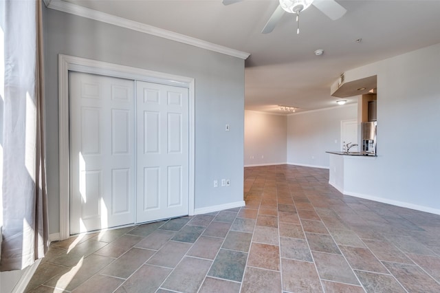 interior space featuring crown molding and ceiling fan