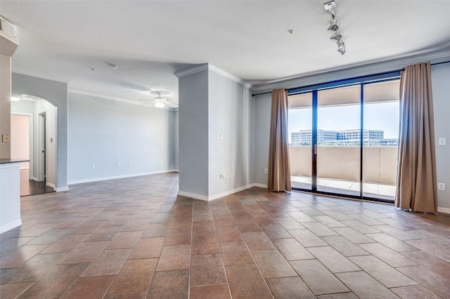 spare room with crown molding, rail lighting, and ceiling fan