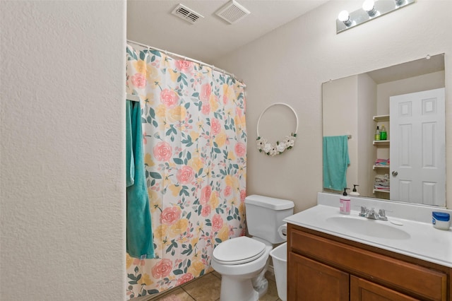 bathroom featuring vanity, tile patterned flooring, a shower with curtain, and toilet