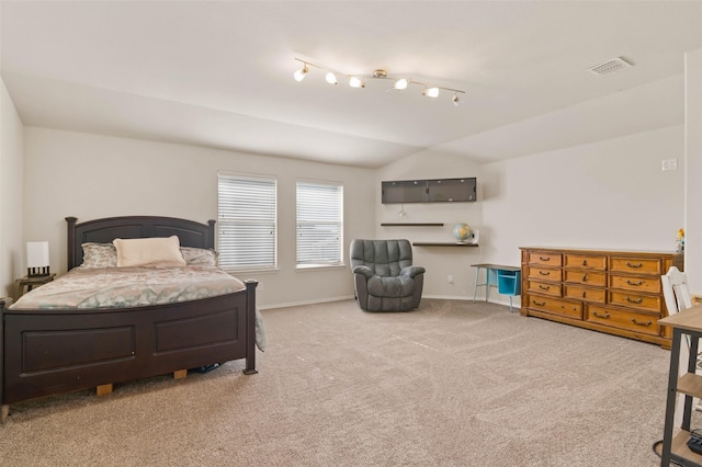 bedroom featuring lofted ceiling and light colored carpet