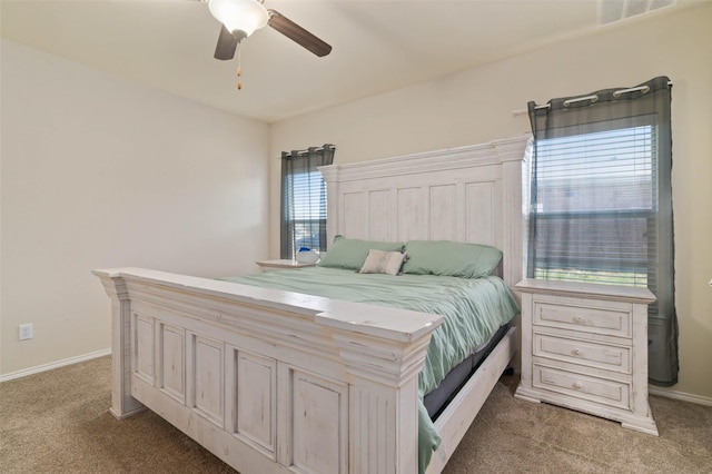 bedroom featuring dark colored carpet and ceiling fan