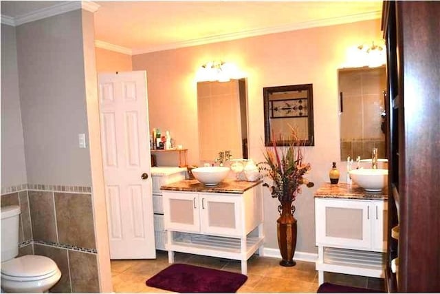 bathroom with vanity, tile patterned flooring, crown molding, and toilet