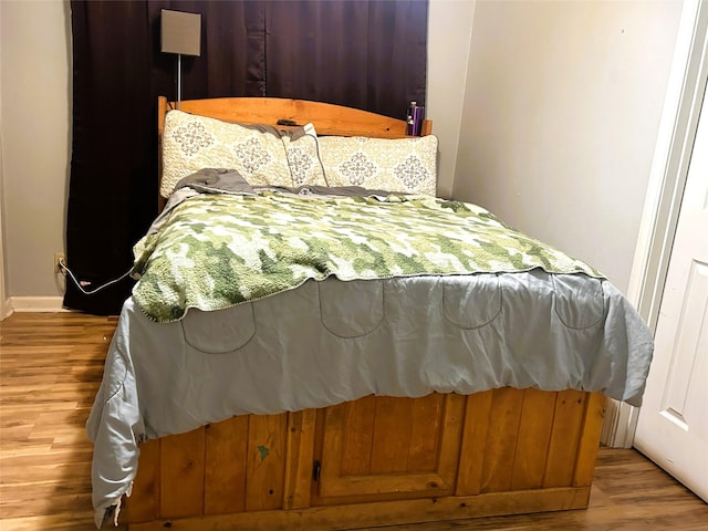 bedroom with light wood-type flooring