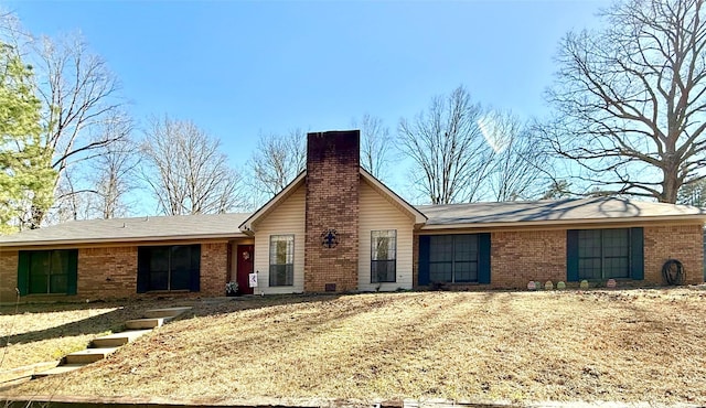 single story home featuring brick siding and a chimney