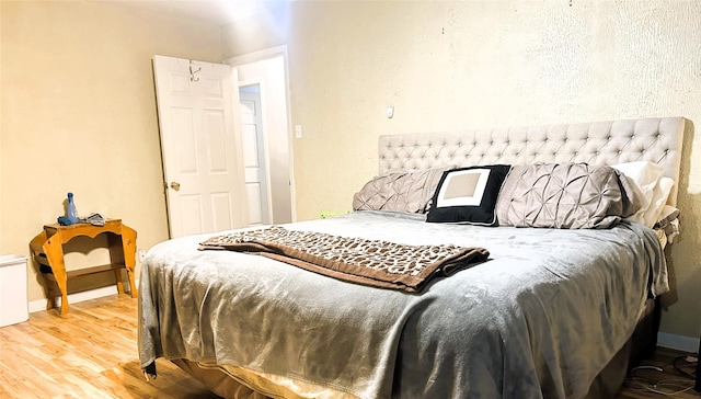 bedroom featuring wood-type flooring