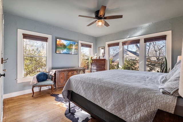 bedroom featuring ceiling fan and light hardwood / wood-style floors