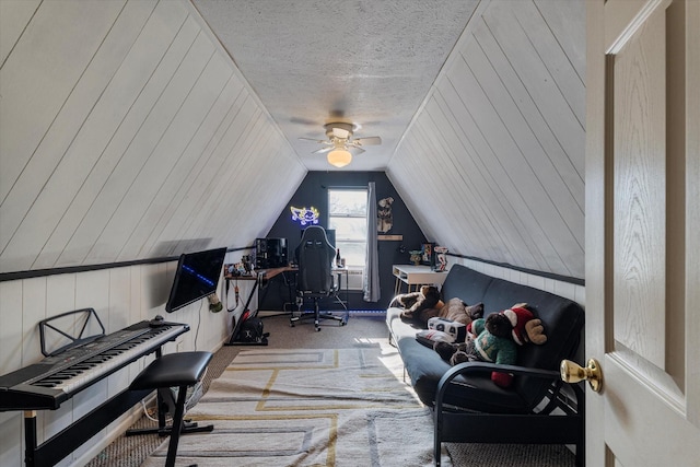 office space featuring carpet, wooden walls, lofted ceiling, and a textured ceiling