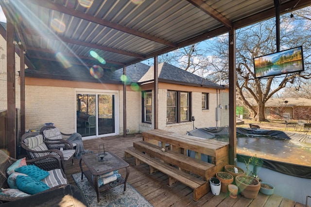 wooden terrace with outdoor lounge area