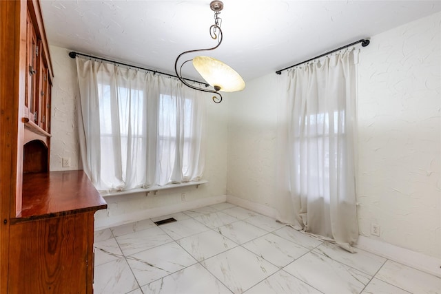 view of unfurnished dining area