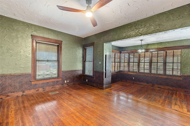 spare room featuring hardwood / wood-style flooring and ceiling fan