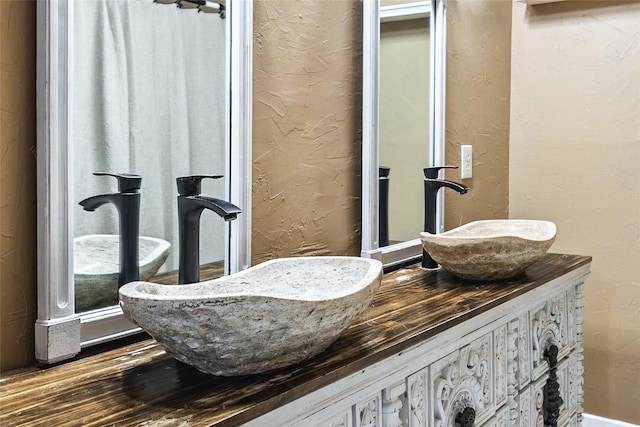 bathroom featuring vanity and hardwood / wood-style floors