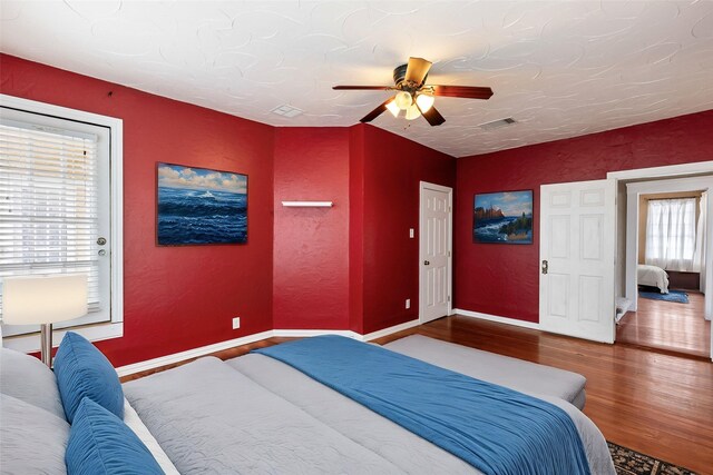 bedroom featuring ceiling fan and hardwood / wood-style floors