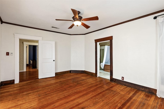 spare room featuring hardwood / wood-style floors, crown molding, and ceiling fan