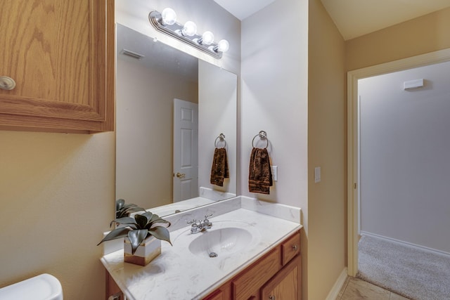 bathroom featuring tile patterned floors and vanity