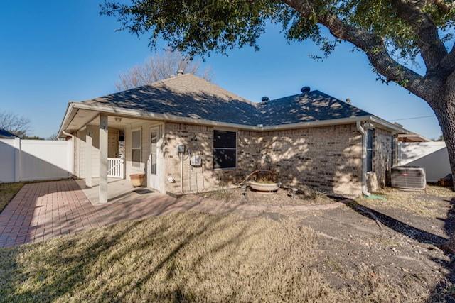 back of property featuring a patio