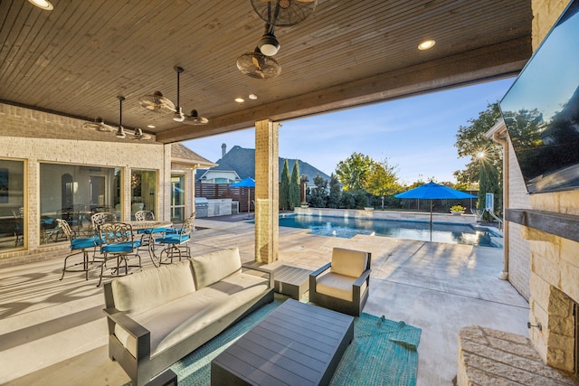 view of patio / terrace with grilling area, outdoor lounge area, and ceiling fan