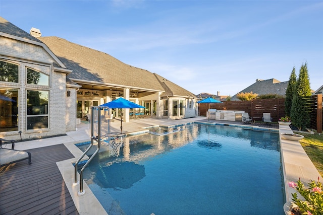 view of pool with a wooden deck