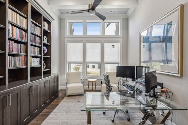 home office featuring wood-type flooring and ceiling fan