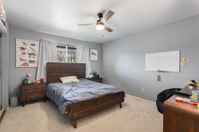 bedroom featuring ceiling fan and light colored carpet