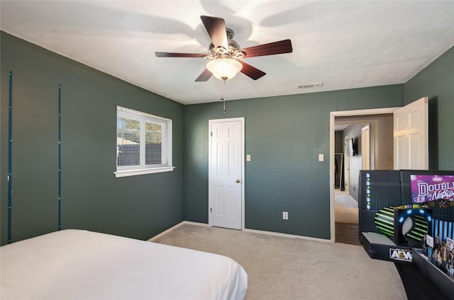 carpeted bedroom with ceiling fan