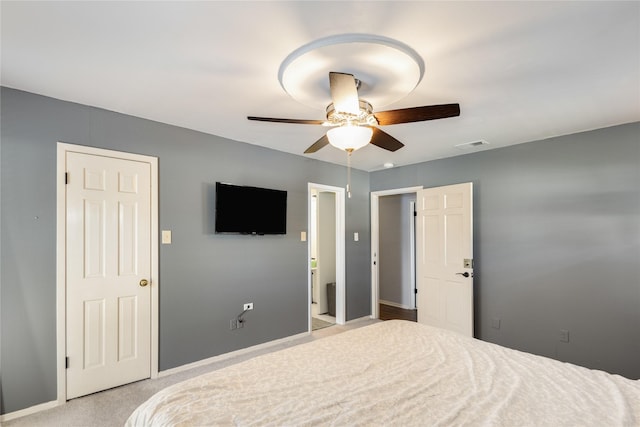 carpeted bedroom featuring ceiling fan