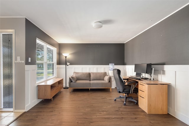 office with ornamental molding and dark hardwood / wood-style floors