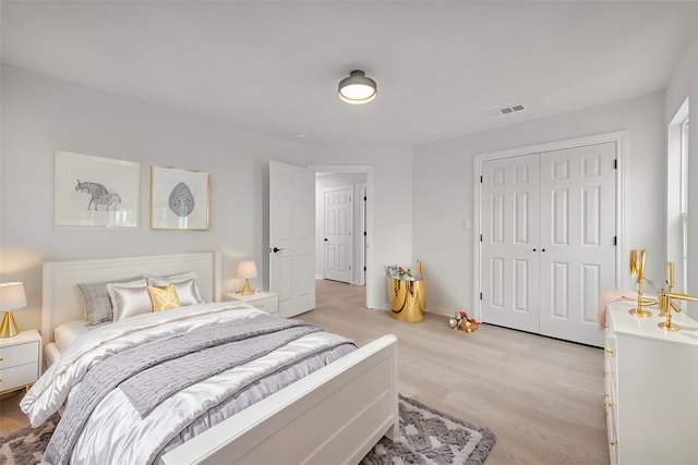 bedroom with a closet and light wood-type flooring