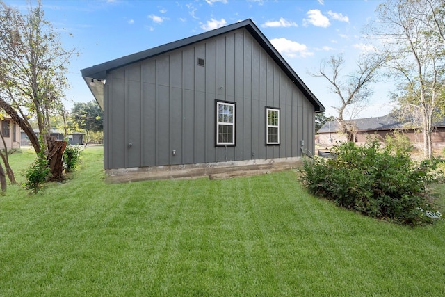 view of property exterior with a lawn