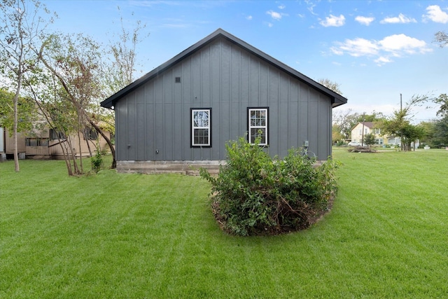 view of property exterior with a yard