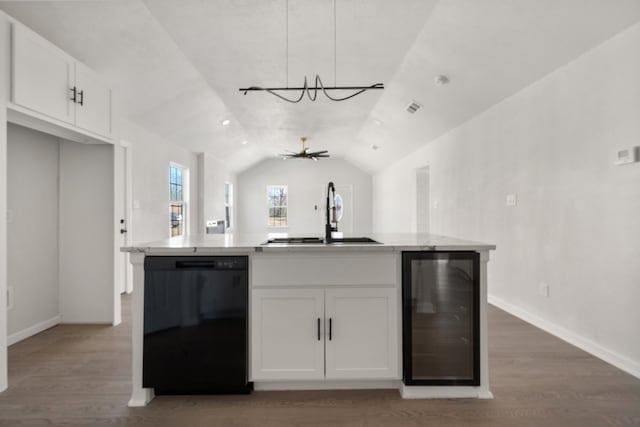 kitchen with decorative light fixtures, white cabinetry, dishwasher, sink, and beverage cooler