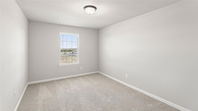 empty room featuring carpet floors