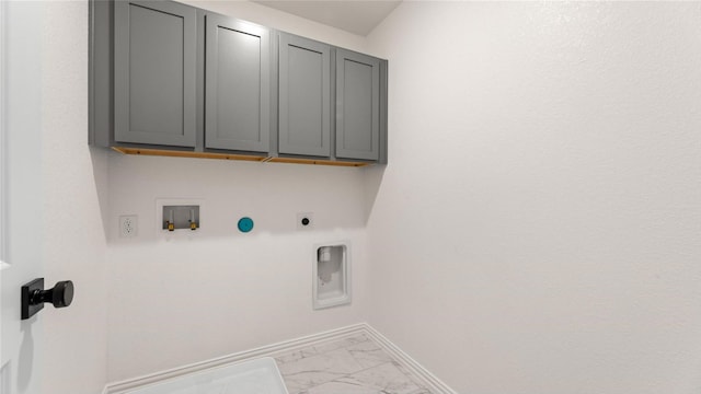 laundry area with cabinets, electric dryer hookup, and hookup for a washing machine