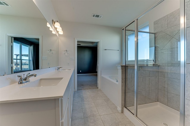 bathroom with vanity, independent shower and bath, and tile patterned flooring